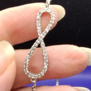 Silver tone infinity adjustable bracelet